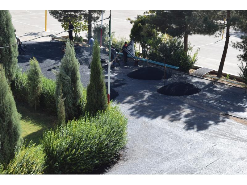 ترمیم روکش آسفالت حیاط مدرسه